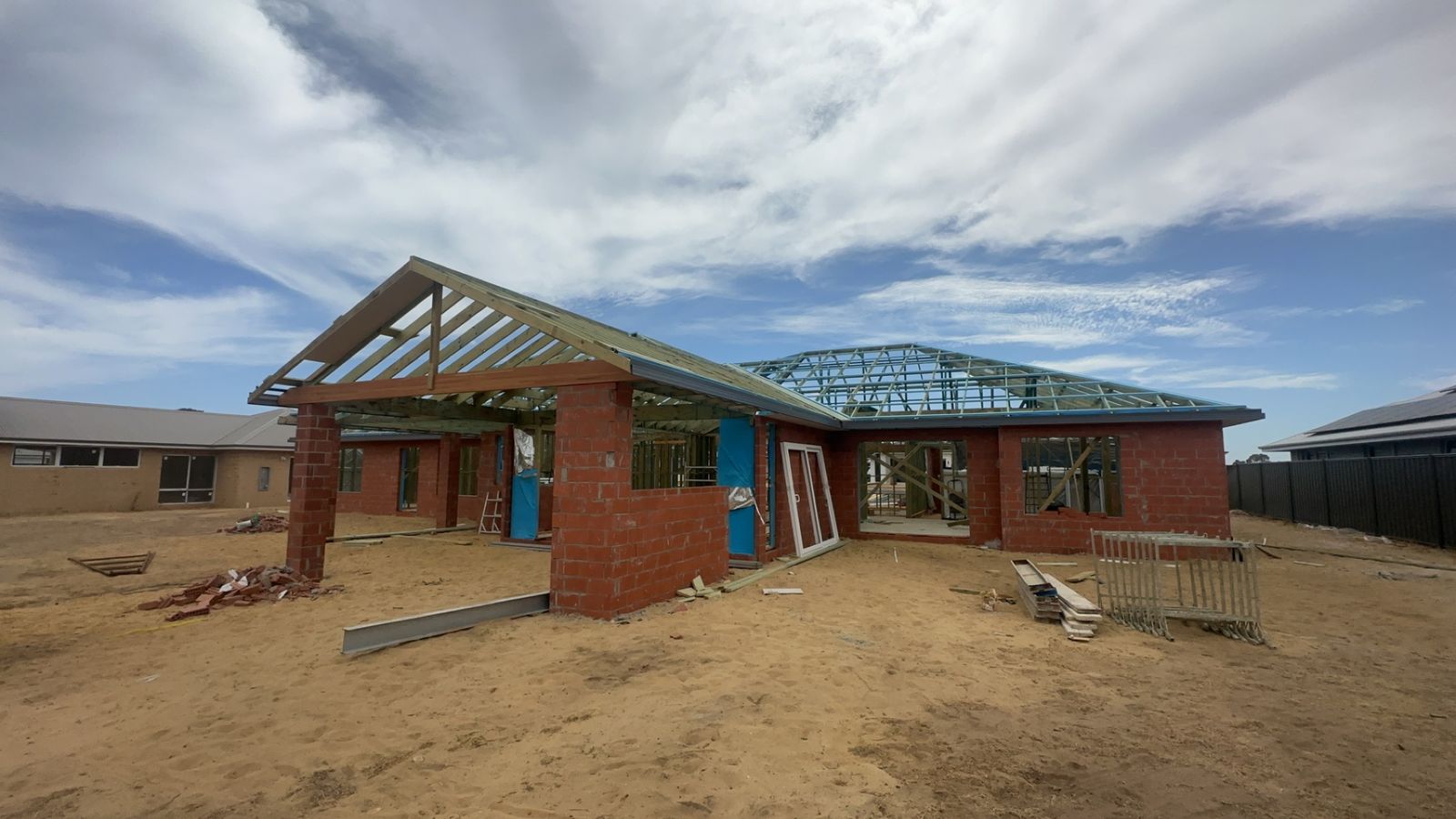 Wall and roof framing on a new brick home