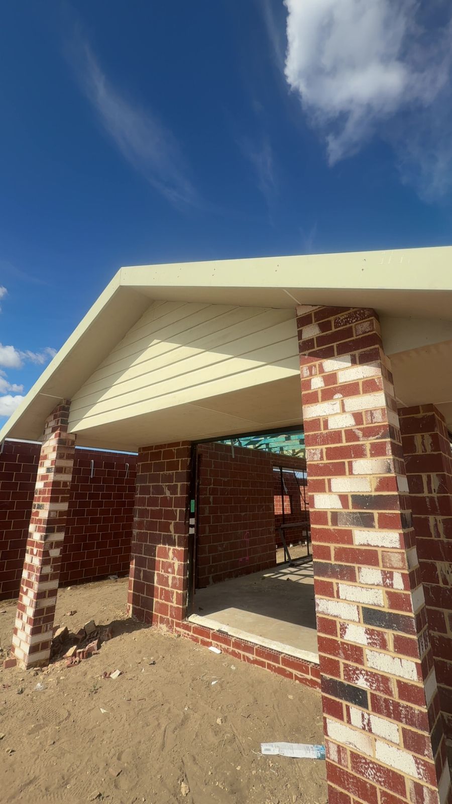 New home build entry portico with face brickwork and gable